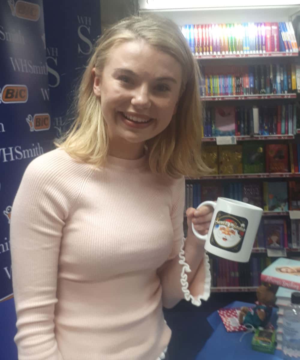 Georgia Toff Toffalo with a Santa Radio mug